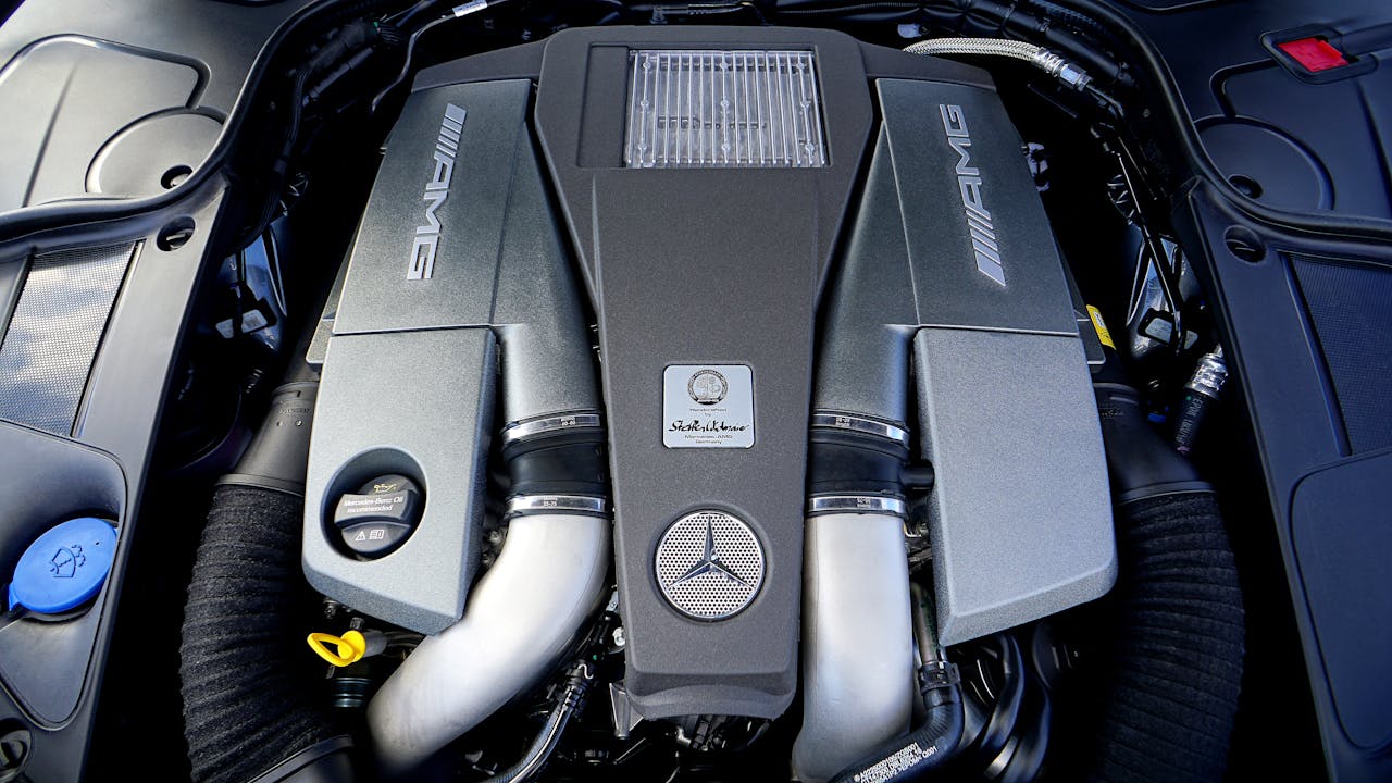 Detailed view of a high-performance car engine with AMG branding.